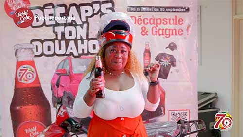 Madame COULIBALY ROKIA  repart toute souriante avec sa moto rouge flambant neuve